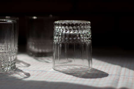 Glass beakers. Transparent glass on the table. Dishes in the kitchen. Washed glasses.の写真素材