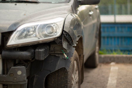 Damaged car headlight. Car breakdown. The car is standing after the accident on the street.の写真素材