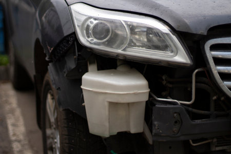 Damaged car headlight. Car breakdown. The car is standing after the accident on the street.の写真素材