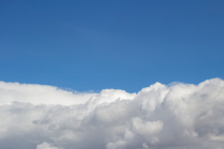 White clouds in the blue sky. Cloud background. Beautiful celestial landscape.の写真素材