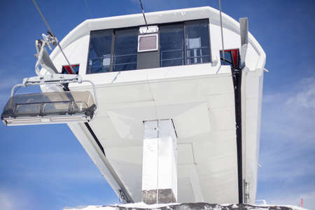 The main unit of the electric cable car. Support post on the ski lift. Sophisticated design aimed at holding metal tross. Hillside equipment for skiing.の写真素材