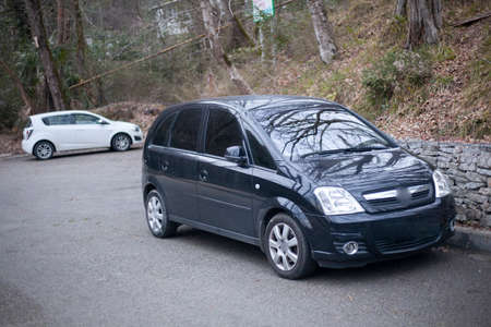 The car is parked on the road. The car is parked. The usual family car. Personal transport.の写真素材
