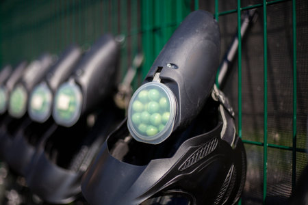 Sports equipment for tactical combat. Markers for firing paint. Balls loaded weapon with acrylic paint. Shotguns stand in a row. Paintball equipmentの写真素材