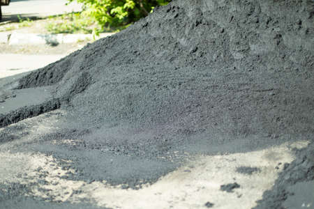 Asphalt on the street. A lot of building stuff. Road repairs.の写真素材