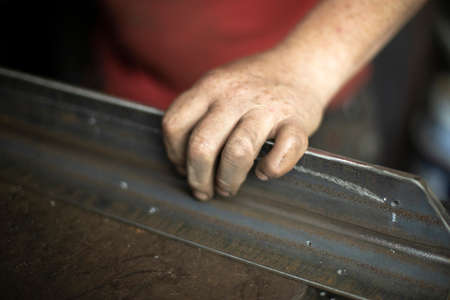 Metal in the workshop. Steel processing. Details of the construction are being processed. Raw iron.の写真素材
