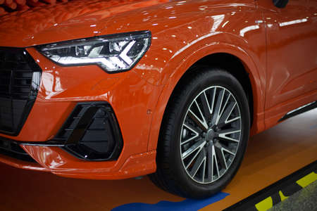 New car. Car wheel at the exhibition. Nice transport. Indoor car.の写真素材