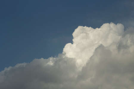 Clouds in the sky. White cumulus cloud close up. Summer weather in the sky.の写真素材