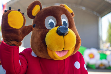 Animator in a bear costume. A man in a full-length suit for the holiday. Russian bear at the...