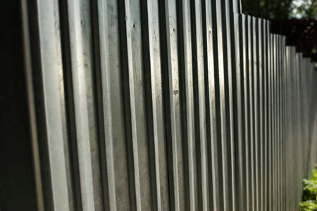 Stainless steel fence. Fencing of the territory. Fence around the construction site.の写真素材