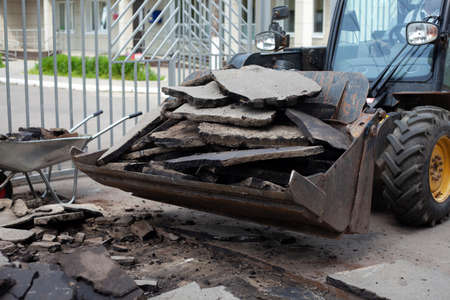 Road repair. Installation of curbs on the highway. The workers are working hard.の写真素材