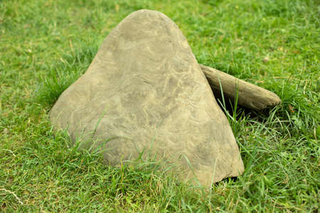 Stone in the garden. Cobblestone in the park. Landscaping in detail. Natural stone on a summer day.の写真素材