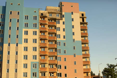 Apartment building in summer. Residential building in the city. Panel structure.の写真素材