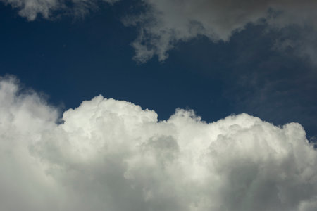 White clouds in the sky. Cumulus clouds against the blue sky. Heavenly background.の写真素材