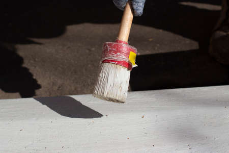 Paint for the street. Painting the object. Marking the road. Work with brush and paint.の写真素材