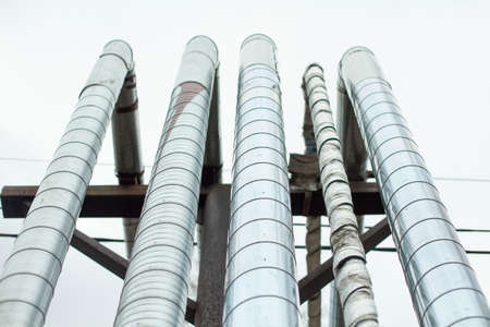 Heating pipes. City communications. Lots of stainless steel sheathed pipes. Industrial equipment. Hot water dispenser.の写真素材