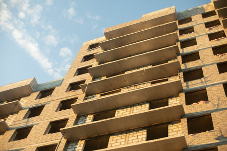 Building a house. Multi-storey building without cladding. Construction of a residential building in Russia. Concrete construction.の写真素材