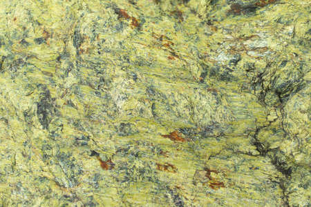 Green stone texture. Stone background in detail. A rare breed of rock. Rough surface.の写真素材
