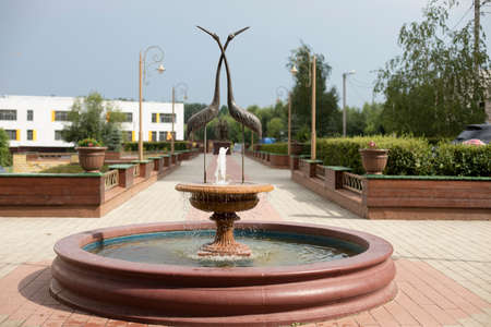 A fountain in the street. Historical style fountain bowl. Park architecture.の写真素材
