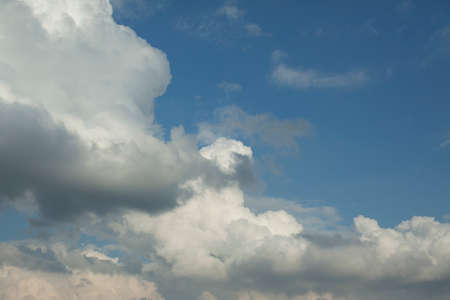 Cumulus clouds in the sky. Large white cloud. Summer weather in the atmosphere.の写真素材