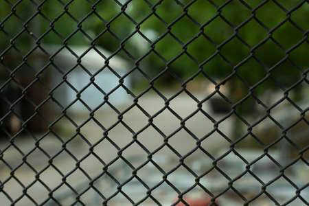 Metal mesh. The texture of the fence. Mesh industrial material made of steel.の写真素材