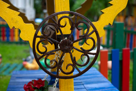 Spindle wheel. Metal circle. Round wrought iron. Well handle. The handle is rotary. Russian metal forging.の写真素材