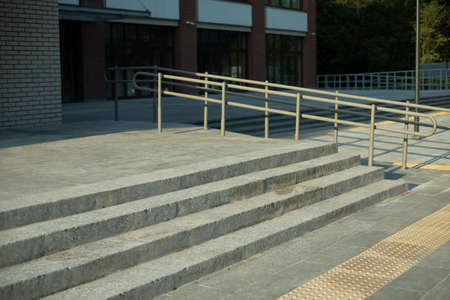 Stairs of four steps in the building. Concrete staircase in the main entrance. Architectural element.の写真素材
