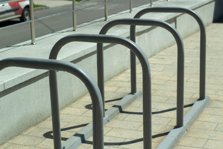 Bicycle parking. Steel racks in the park. Place for fastening with a bike chain. Urban architecture...