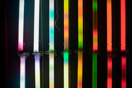 Colored RGB lamps. The glow of all colors from fluorescent lamps in the dark.の写真素材