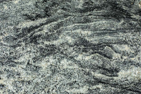Rock texture. Background surface of the stone. Rocky hard rock. Cobblestones in detail.の写真素材