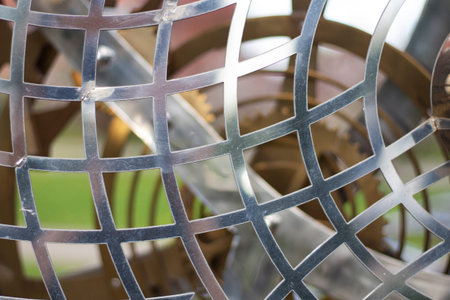 Metal mesh made of steel. An element of steel structure. Beautiful design of the object.