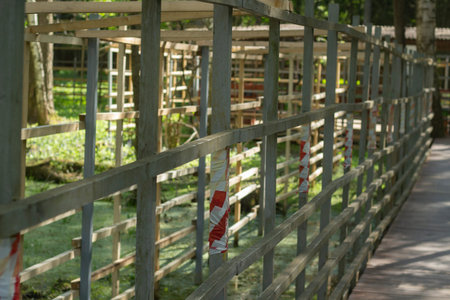 Fence along the territory. Just a fence. An obstacle for a person. Private territory.