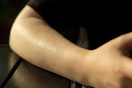 Girl's elbow. A hand without clothes. From shoulder to brush. Young skin.の写真素材