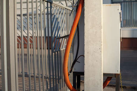 Corrugation for electrical wiring. Hidden wires. Corrugated hose. Winding to protect against damage to electrical wiring.の写真素材