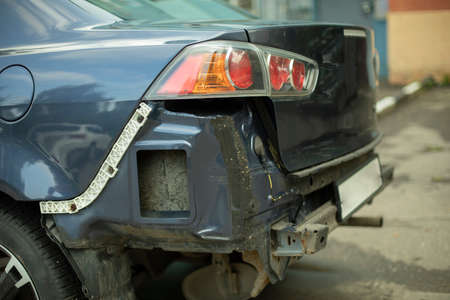 A car without a bumper. Damaged part of the transport. Car after the accident. Car repair details.の写真素材