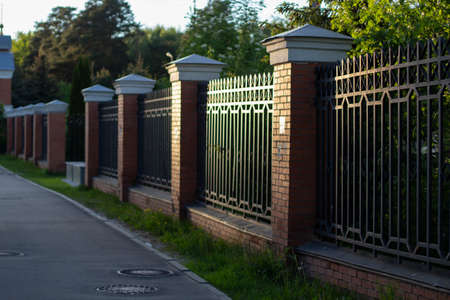 Fence along the territory. Just a fence. An obstacle for a person. Private territory.の写真素材