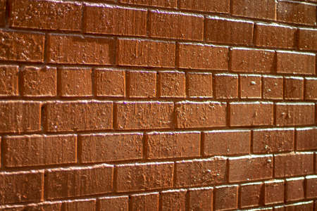 Brick wall. The texture of the masonry. Red brick in the building. Natural light on the wall.の写真素材