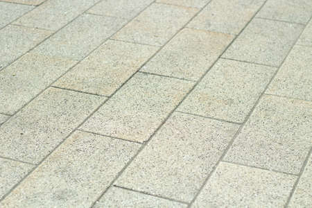 Tiles in the pedestrian zone. The texture of the road surface for pedestrians.の写真素材