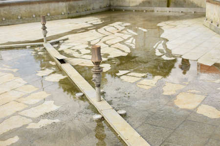 Disconnected fountain. Fountain without water. Repair work in water equipment.の写真素材