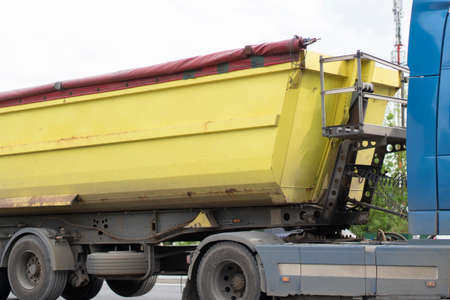 Freight transport on the highway. A vehicle to transport goods in the flow of cars. Busy traffic on the highway.の写真素材