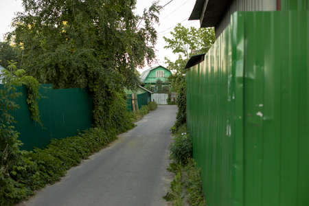 Fence along the territory. Just a fence. An obstacle for a person. Private territory.の写真素材