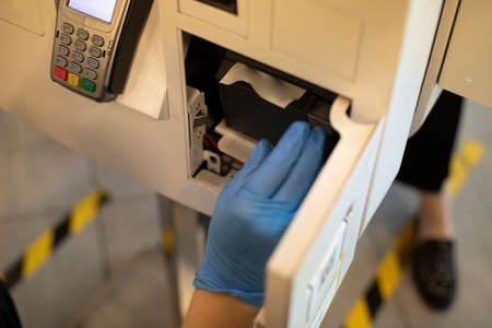 Replacement of the cash register tape. Receipt tape reader. Data reading equipment. Installing a spool of paper.の写真素材