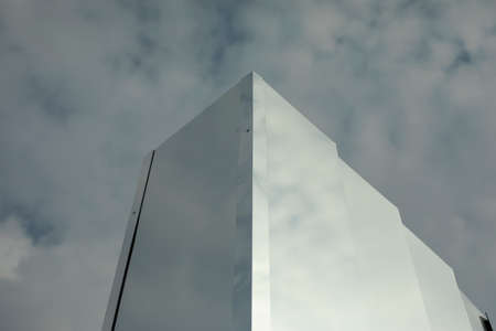 Mirror against the sky. Mirror construction on the street. Architectural details. Reflective surface.の写真素材