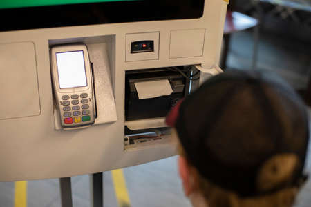 Replacement of the cash register tape. Receipt tape reader. Data reading equipment. Installing a spool of paper.の写真素材