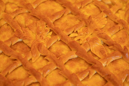 Baked pie. Ruddy pie from the village. Delicious pastries. Texture Russian cuisine. National food in Russia.の写真素材