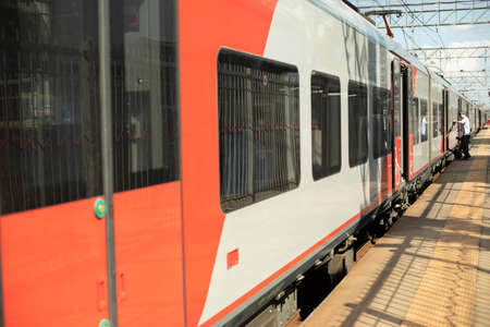 The train arrived at the station. Rail transport in the city. public transport.の写真素材
