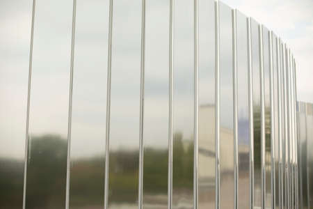 Mirror wall. Rusty surface in the park. Details of the architecture of park objects. Mirror stand for photos.の写真素材
