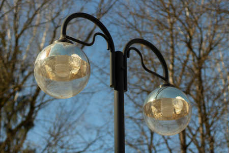 Street lighting during the day. Lighting in the park. Stand for light bulbs.の写真素材
