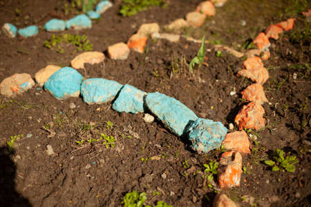 Stones in the garden. Ornament of small stones on the ground. Garden decoration.の写真素材
