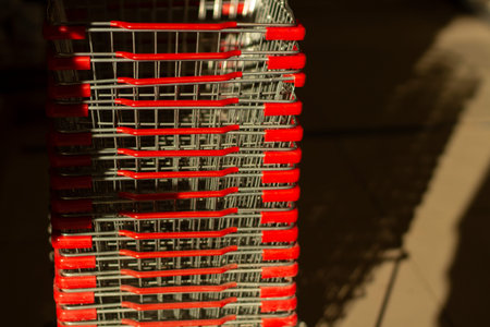 Food baskets are stacked. Super makeup details. Food basket with red handles. Light falls on steel containers.の写真素材