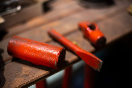 Working tools in the garage. Details of the metal workshop. Hand tools for processing steel billets.
